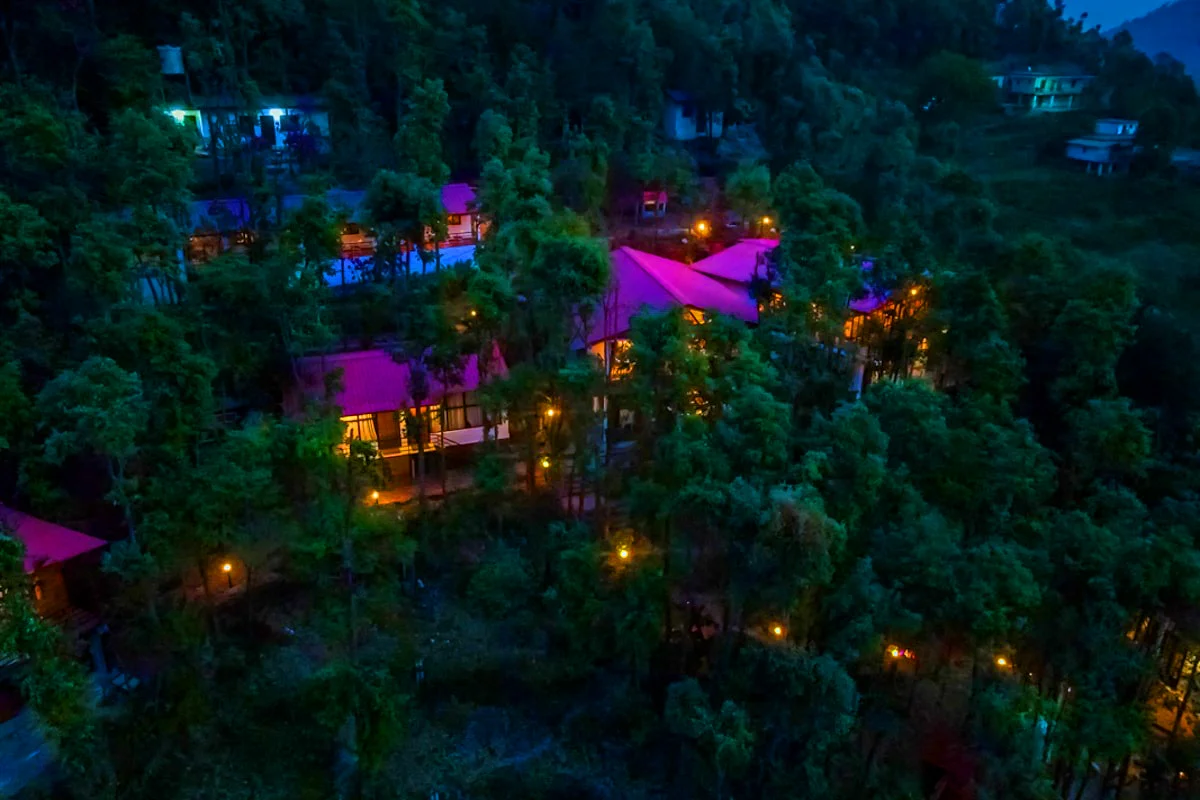Upcoming luxury hotel in New Delhi with illuminated glass facade at night